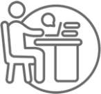 Person profile at desk with computer 